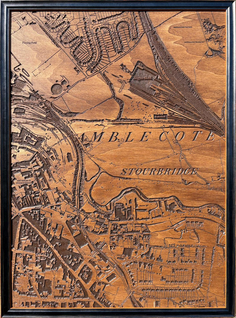 A framed CNC-carved wooden map of Amblecote High Street, carved in hardwood from an 1892 historical cartographic map, ready to hang wall art.